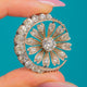 Victorian Silver Paste Crescent & Flower Pendant, front view of the Paste crescent and flower on blue
