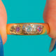 18ct Gold Ruby and Diamond gypsy ring, front view of the three star settings