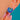 Blue Enamel shell earring worn close-up to show its fan shape